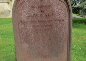 cast iron grave marker of Alfred Crisp