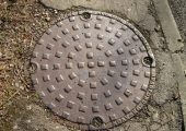 Crisp cast iron sewer inspection cover
